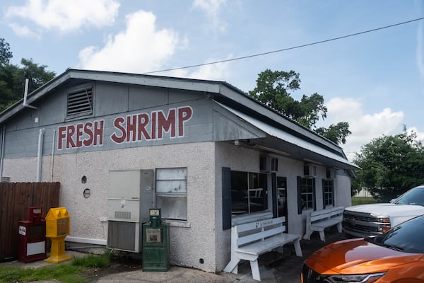 The exterior of B&J's Steaks & Seafood in Darien, an old-school seafood shack with large letters painted on the side of the building that say "Fresh Shrimp"