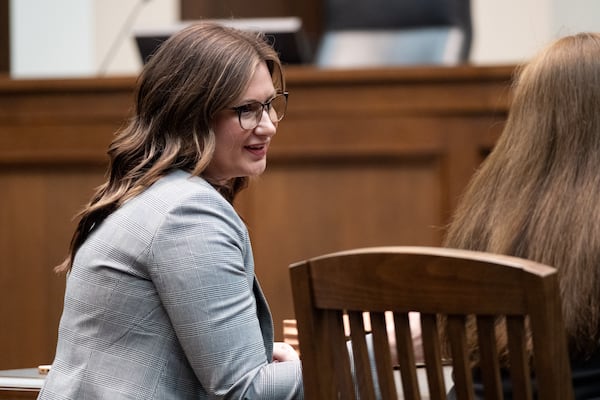 Courtney Veal, director of the Georgia Judicial Qualifications Commission, talks with a colleague before a hearing in Atlanta on Dec. 19, 2024. (Ben Gray for The Atlanta Journal-Constitution)