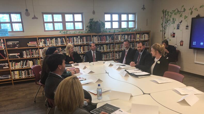Gov. Brian Kemp meets with administrators and health officials at Dawson County High School. While at the school, he asked health officials and teachers about the availability of counselors to address mental health issues.