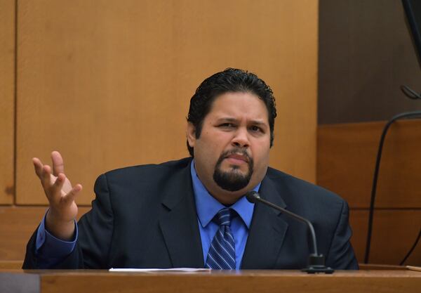 Emory Police Department Officer Frank Stroupe testifies during Day 8 of the Tex McIver murder trial at Fulton County Courthouse on Thursday, March 22, 2018. HYOSUB SHIN / HSHIN@AJC.COM