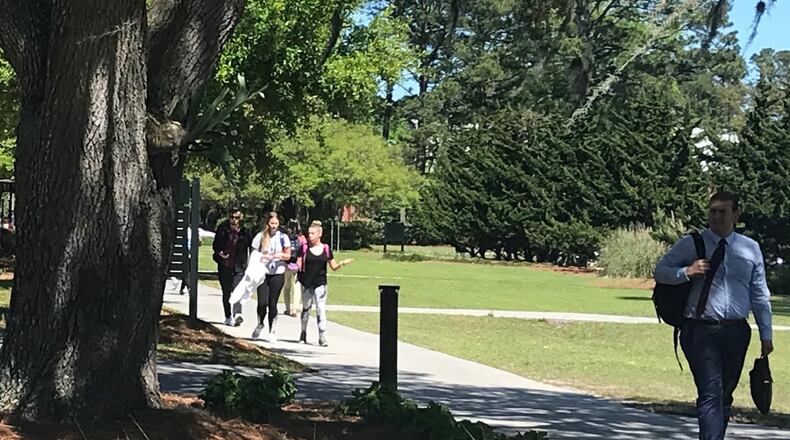 Students walk on the Georgia Southern University campus in Savannah on Tuesday, April 16, 2019. Fees, required courses and arrangements for deferred some tuition payment are among higher education issues on the horizon next year in Georgia. ERIC STIRGUS / ESTIRGUS@AJC.COM.