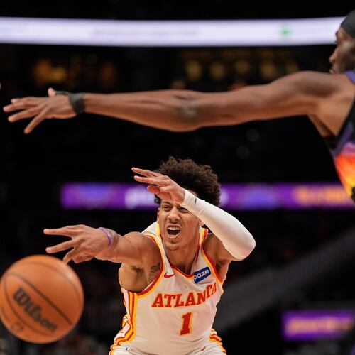 Atlanta Hawks forward Jalen Johnson (1) passes against Phoenix Suns center Mark Williams (15) during the first half of an NBA basketball game, Friday, Jan. 23, 2026, in Atlanta. (AP Photo/Mike Stewart)
