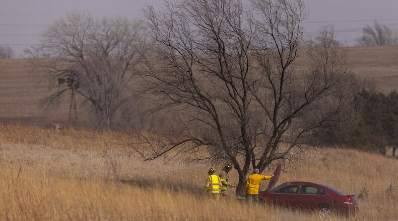 Malcolm and Lincoln firefighters respond to a wildfire in Denton, Neb., on Thursday, March 12, 2026. (Kenneth Ferriera/Omaha World-Herald via AP)
