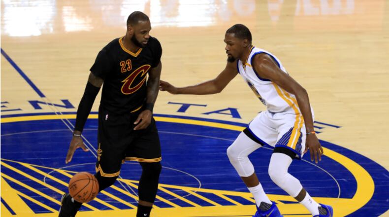LeBron James of the Cleveland Cavaliers is defended by Kevin Durant of the Golden State Warriors during the second half of Game 2 of the 2017 NBA Finals at ORACLE Arena on June 4, 2017 in Oakland, California. (Photo by Ronald Martinez/Getty Images)