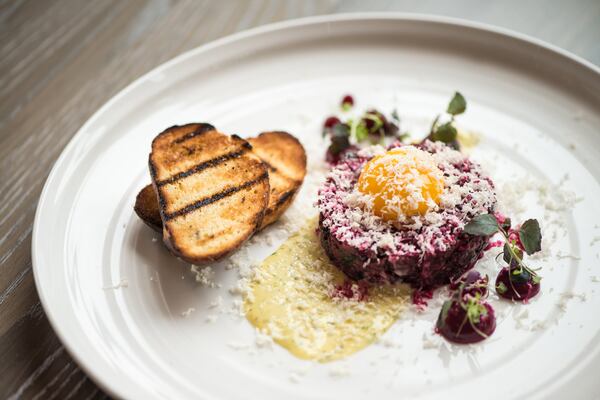 Tin Tin Steak Tartare with classic accoutrements, fresh horseradish, beets, and oyster aioli. Photo credit- Mia Yakel.