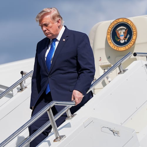 President Donald Trump exits Air Force One at Morristown Municipal Airport in Morristown, N.J., Friday, July 31, 2026, after a trip to Camp David, the presidential retreat. (AP Photo/Jacquelyn Martin)