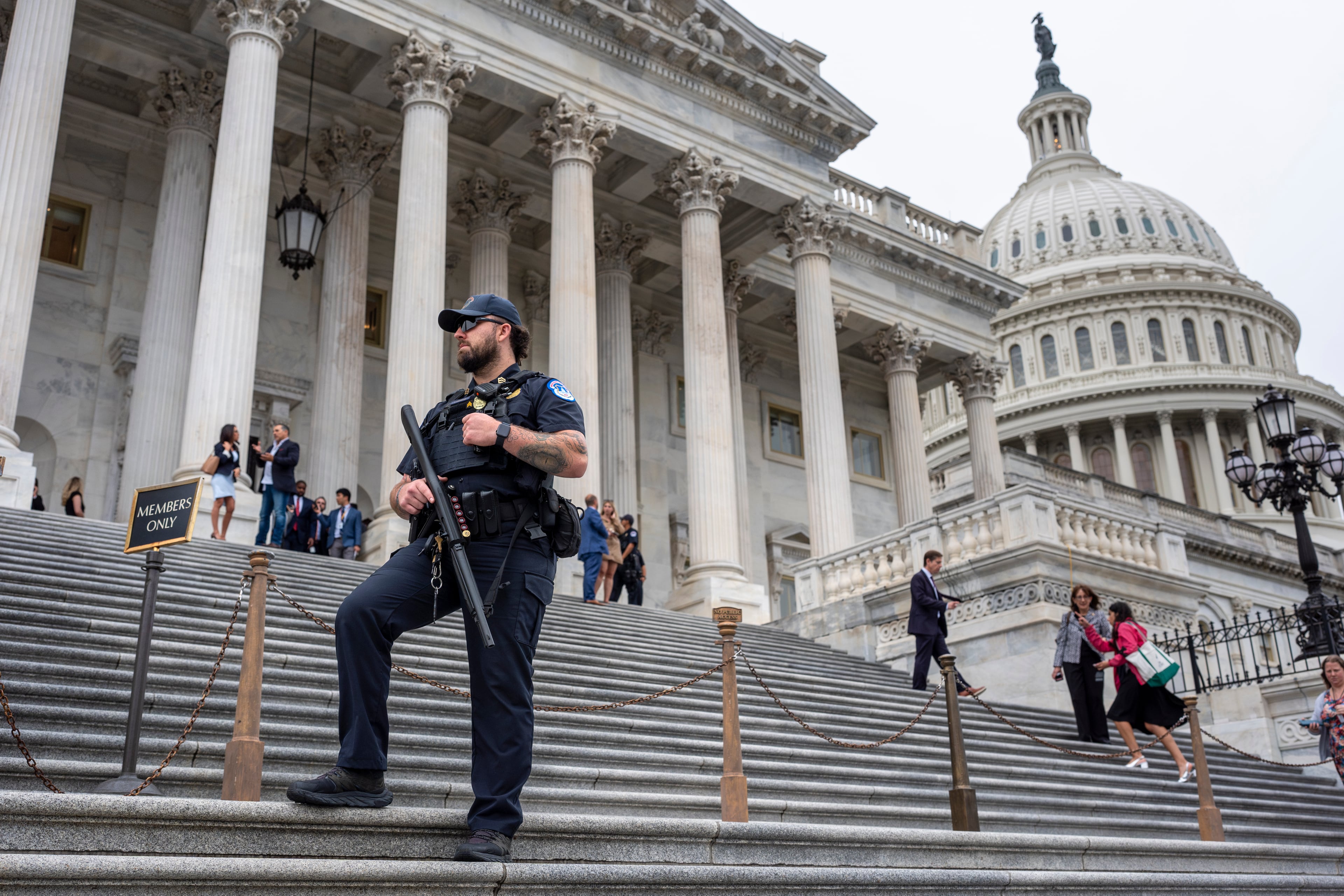 A U.S. Capitol Police officer stood watch last week as lawmakers left the House of Representatives.