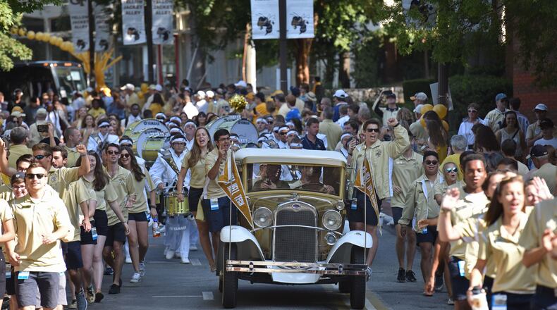 Georgia Tech's Ramblin' Wreck leads the band, cheerleaders, players and coaches during the Players' Walk before the home opener against the Jacksonville State in September. HYOSUB SHIN / HSHIN@AJC.COM