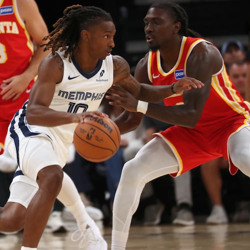Grizzlies guard Javon Small (center) drives against Hawks guard Keaton Wallace (right) in the first half Saturday, Oct. 11, 2025, in Memphis, Tenn. Wallace had a solid all-around game with six points, seven assists, two rebounds and three steals. (Nikki Boertman/AP)