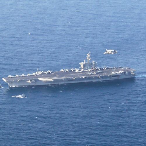 FILE - The USS Abraham Lincoln carrier and a U.S. Air Force B-52H Stratofortress, conduct joint exercises in the U.S. Central Command area of responsibility in Arabian Sea June 1, 2019. (Mass Communication Specialist 1st Class Brian M. Wilbur/U.S. Navy via AP, File)