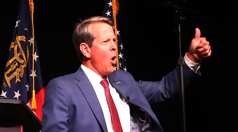 052422 Atlanta: Governor Brian Kemp reacts to cheering supporters as he take the stage to deliver his election night party speech at the College Football Hall of Fame on Tuesday, May 24, 2022, in Atlanta.    “Curtis Compton / Curtis.Compton@ajc.com”