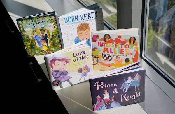 A selection of books featuring LGBTQ characters that are part of a Supreme Court case are pictured, Tuesday, April, 15, 2025, in Washington. (AP Photo/Pablo Martinez Monsivais)