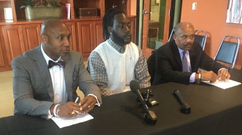 William Henry Miller, center, is suing Hapeville police following his wrongful arrest last year. Credit: Davis Bozeman Law Firm