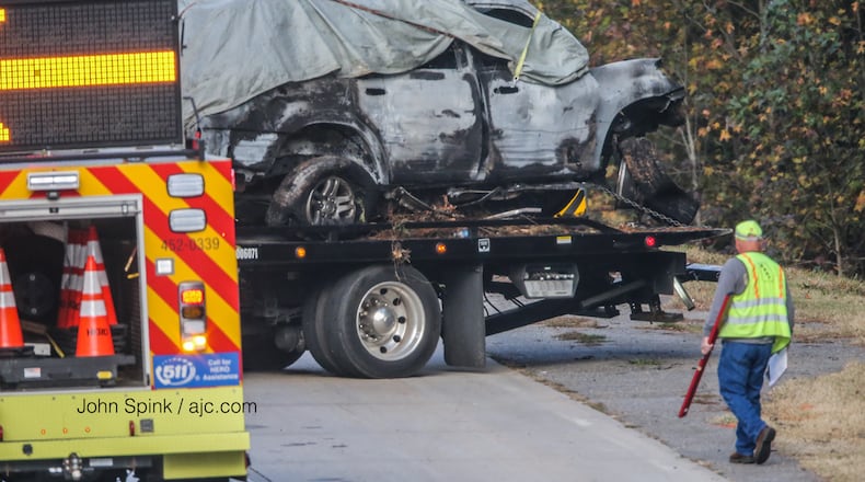 Authorities were on I-75 North in Cherokee County early Tuesday after a vehicle left the interstate and caught fire. The driver and two passengers were found dead.