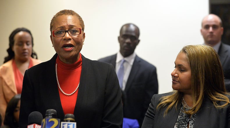 Sharon Davis-Williams, one of three former Atlanta Public Schools regional directors found guilty on April 1 in a massive test-cheating trial, speaks Friday as her attorney, Teresa Mann, listens during a news conference held at the Atlanta law offices of George Lawson, defense attorney for convicted former APS regional director Michael Pitts. (KENT D. JOHNSON /KDJOHNSON@AJC.COM)