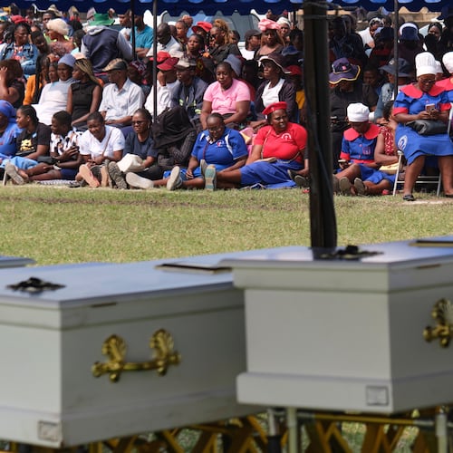 Mourners gather for a memorial service for the victims of a ferry capsized on lake Kariba in Kariba, Zimbabwe, Thursday, Aug. 13, 2026. (AP Photo/Mkhululi Thobela)