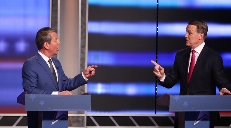 From the start of the debate, Governor Brian Kemp (left) had to defend himself from constant attacks from the former Sen David Perdue during the first debate of the Republican primary for governor on Sunday, April 24, 2022. (Miguel Martinez/Atlanta Journal Constitution/TNS)