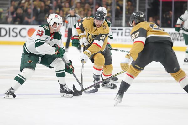 Vegas Golden Knights defenseman Brayden McNabb (3) skates past Minnesota Wild center Marco Rossi (23) during the first period in Game 1 of an NHL hockey Stanley Cup first-round playoff series Sunday, April 20, 2025, in Las Vegas. (AP Photo/Ian Maule)
