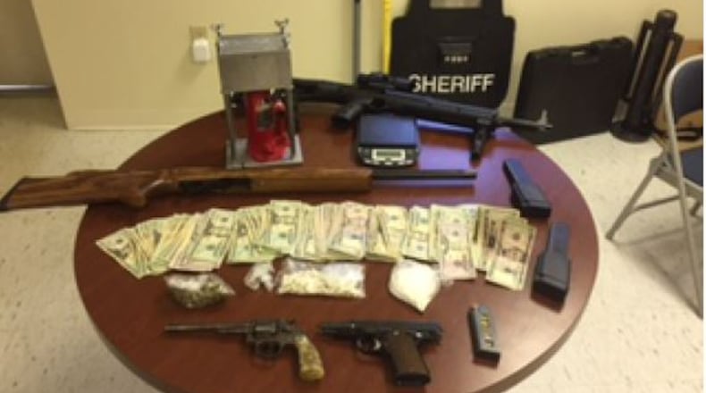 After getting a search warrant, officials found 125 grams of cocaine, 32 grams of marijuana and more than a gram of ecstasy in a Conyers house. (Credit: Rockdale County Sheriff’s Office)