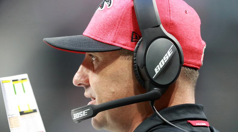 Atlanta Falcons offensive coordinator Steve Sarkisian calls a play from the sidelines.