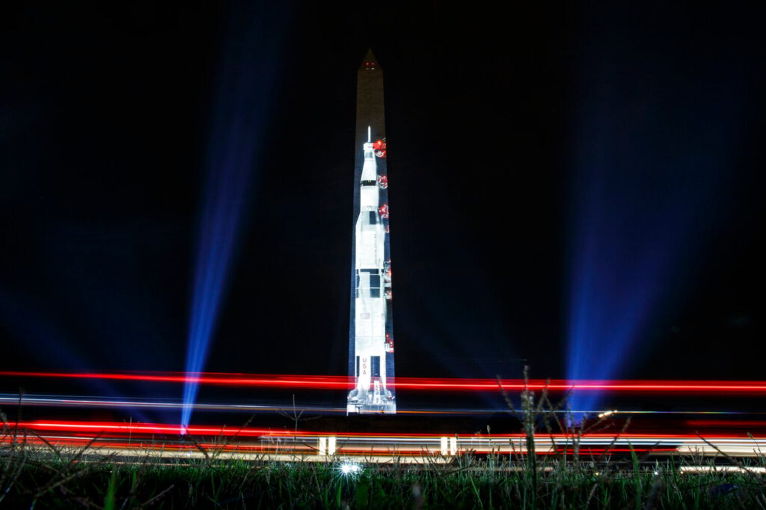 Photos: Apollo 11 Saturn V rocket lights up Washington Monument