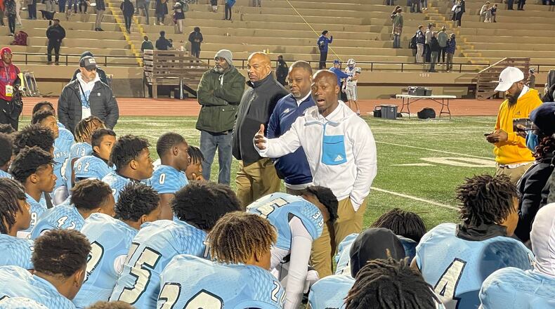 Cedar Grove coach John Adams talks to his team after its 23-0 win over Oconee County in the Class 3A semifinals.