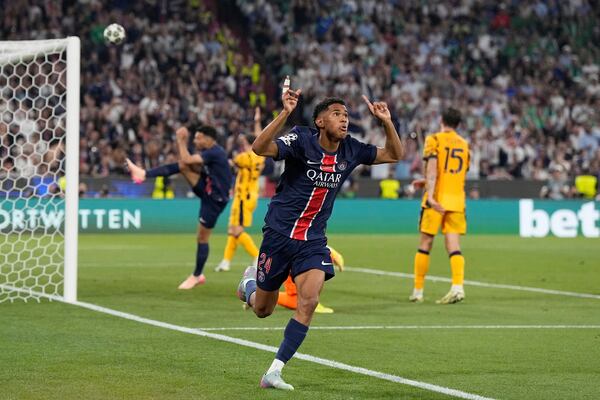 PSG's Senny Mayulu celebrates after scoring his side's fifth goal during the Champions League final soccer match between Paris Saint-Germain and Inter Milan at the Allianz Arena in Munich, Germany, Saturday, May 31, 2025. (AP Photo/Martin Meissner)