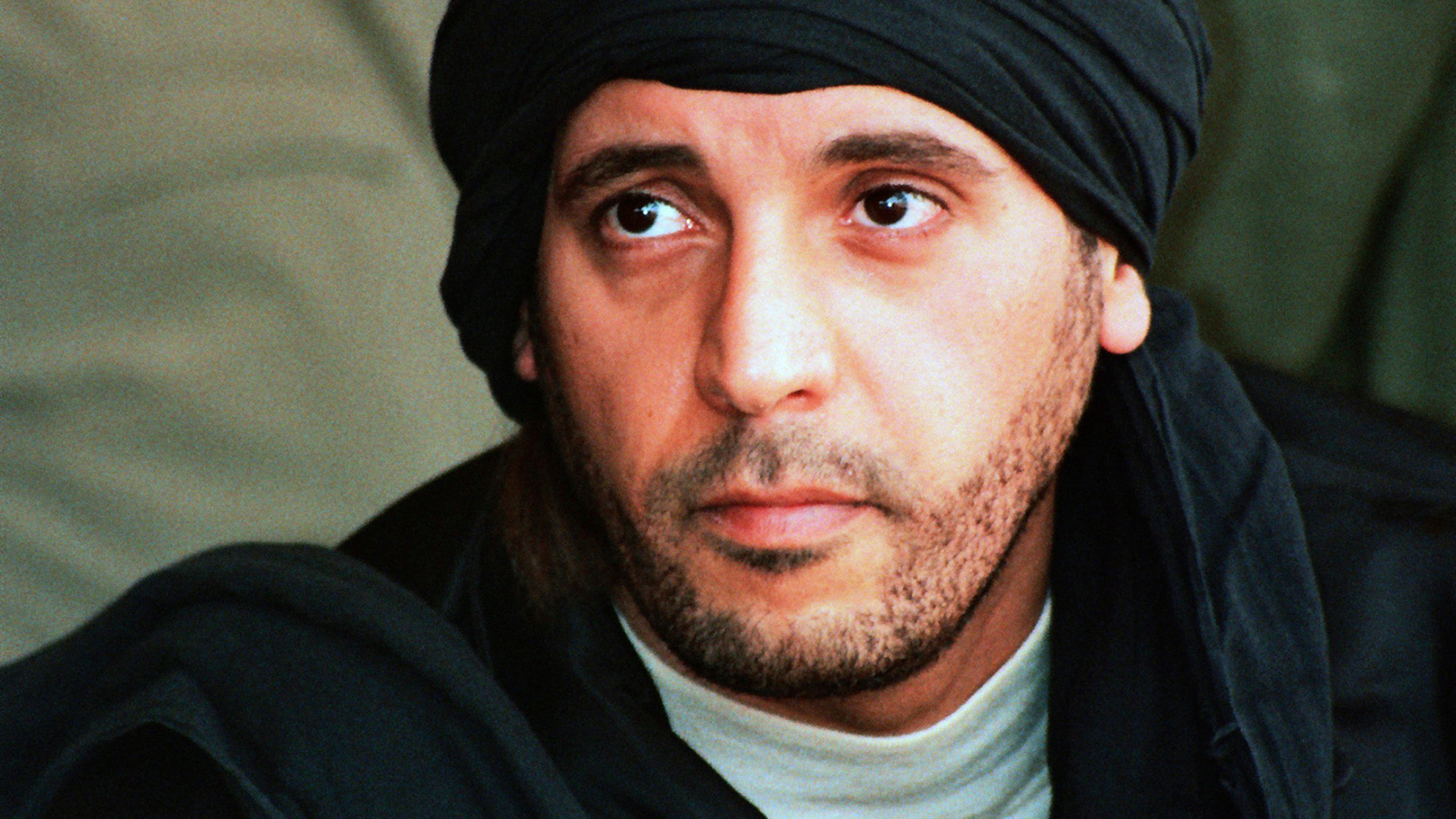 FILE - In this undated file photo made available Sept. 25, 2011, Hannibal Gadhafi, son of ousted Libyan leader Moammar Gadhafi, watches an elite military unit exercise in Zlitan, Libya. (AP Photo/Abdel Magid al-Fergany, File)