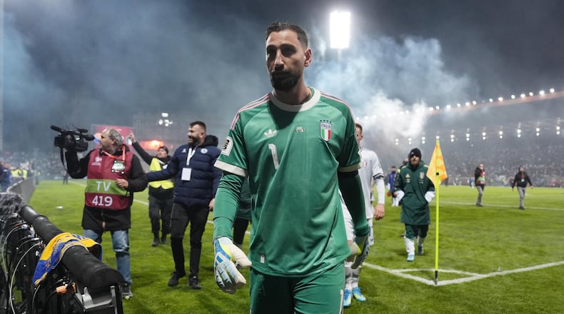 Italy's Gianluigi Donnarumma walks off the pitch after losing in a World Cup qualifying playoff final soccer match between Bosnia and Italy in Zenica, Bosnia, Tuesday, March 31, 2026. (Fabio Ferrari/LaPresse via AP)
