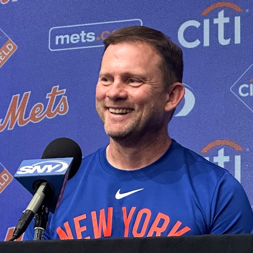 Andy Green smiles as he responds to questions during a news conference where he was introduced as the New York Mets new manager before a baseball game against the Texas Rangers Tuesday, Sept. 22, 2026, in Arlington, Texas. (AP Photo/Stephen Hawkins)