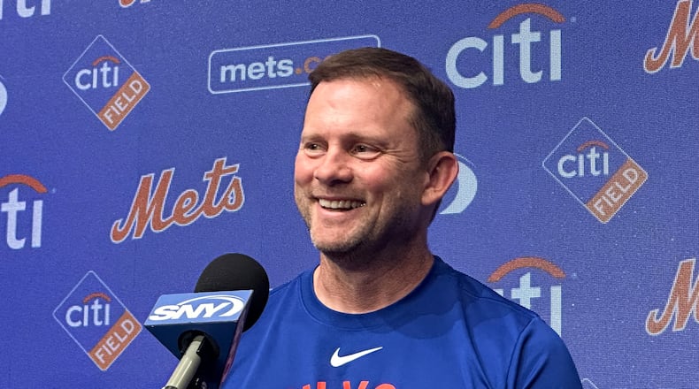 Andy Green smiles as he responds to questions during a news conference where he was introduced as the New York Mets new manager before a baseball game against the Texas Rangers Tuesday, Sept. 22, 2026, in Arlington, Texas. (AP Photo/Stephen Hawkins)