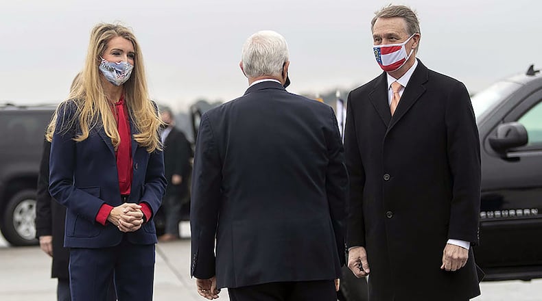 Georgia Sens. David Perdue, right, and Kelly Loeffler have filed a lawsuit seeking to eliminate what they say is double-voting in the upcoming runoff election.  (Alyssa Pointer/Atlanta Journal-Constitution/TNS)