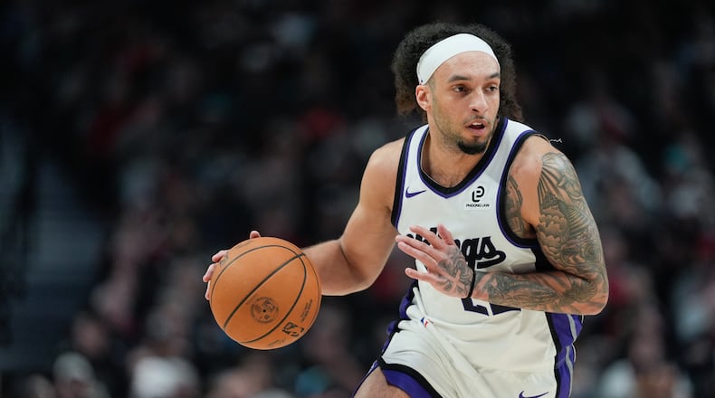 Sacramento Kings guard Devin Carter dribbles during the first half of an NBA basketball game against the Portland Trail Blazers, Sunday, April 12, 2026, in Portland, Ore. (Jenny Kane/AP)