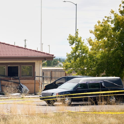 FILE - A hearse and van sit outside the Return to Nature Funeral Home in Penrose, Colo., on Oct. 6, 2023. (AP Photo/David Zalubowski, File)