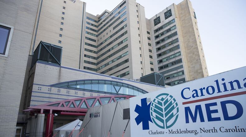 Grady Memorial Hospital in Atlanta spent about $200,000 to rent the Carolinas MED-1 mobile emergency room in a specialized tractor-trailer, for the overflow of flu patients. The Georgia Hospital Association says hospitals are “inundated” with patients, many of whom don’t have emergency symptoms. However, the flu has also killed 66 in Georgia this season. ALYSSA POINTER/ALYSSA.POINTER@AJC.COM