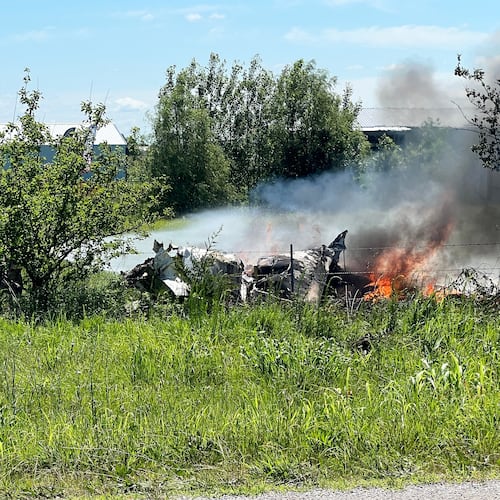 The wreckage of a plane crash burns in a field in Butler, Mo, Sunday, June 14, 2026. (Mid America News Review via AP Photo )