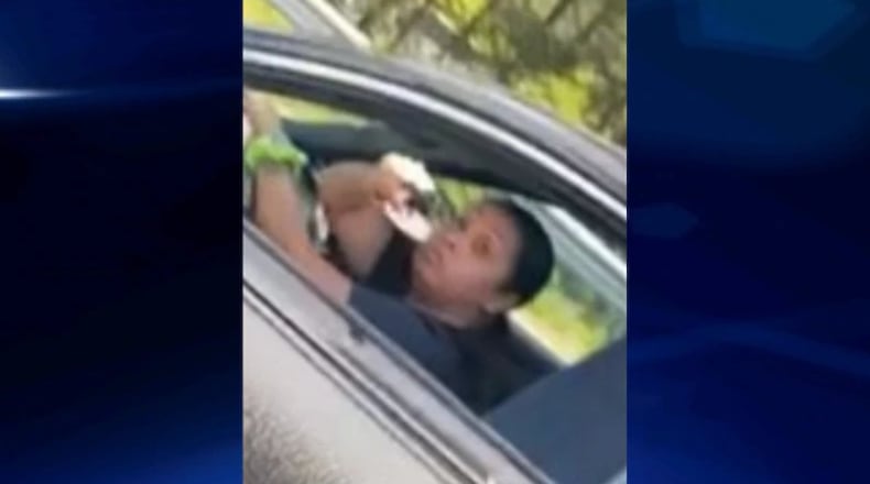 A woman is in custody after being accused of shooting a teenager in the face in a case of road rage, police said.