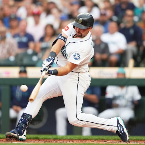 Seattle Mariners' Cal Raleigh hits a solo home run during the second inning of a baseball game against the Philadelphia Phillies, Tuesday, Aug. 25, 2026, in Seattle. (AP Photo/Lindsey Wasson)