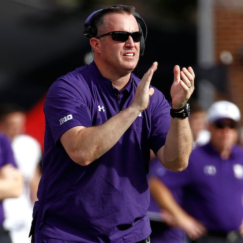 FILE - In this Oct. 14, 2017, file photo, Northwestern head coach Pat Fitzgerald claps during the first half of an NCAA college football game against Maryland in College Park, Md. (AP Photo/Patrick Semansky, File)