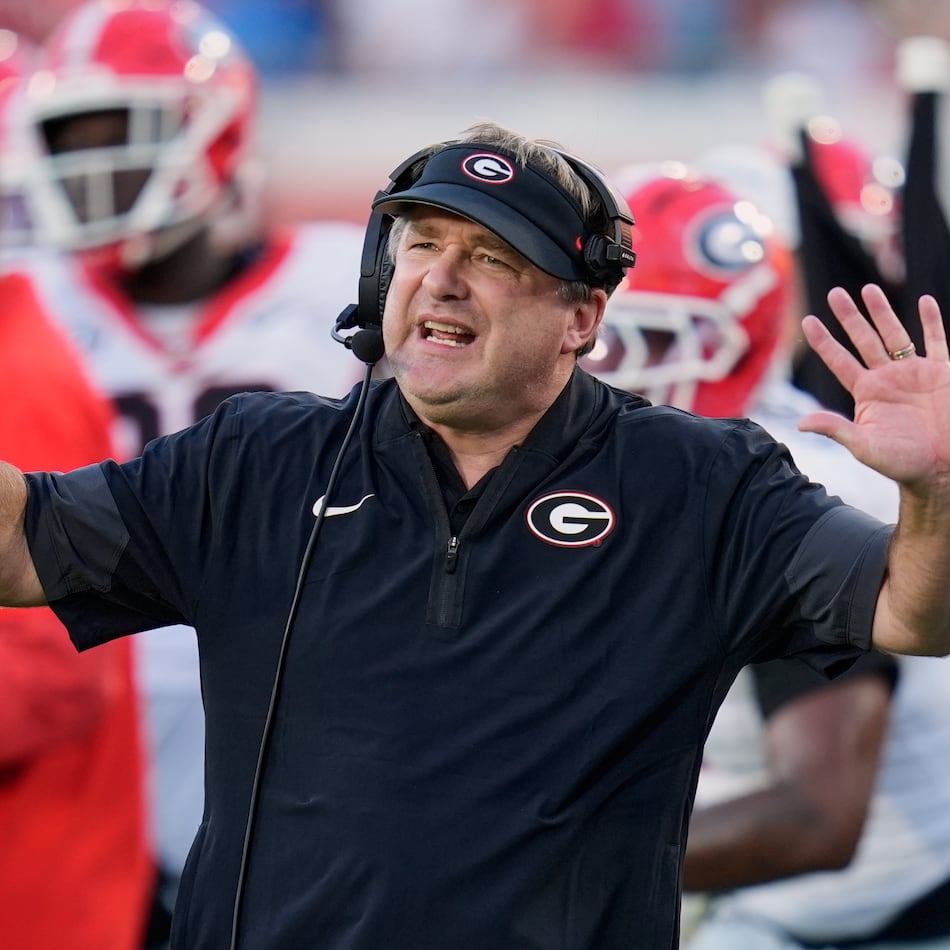 Georgia and coach Kirby Smart — pictured motioning to players on the field against Florida on Nov. 1 — may miss out on playing in the SEC championship game but still earn a first-round bye in the College Football Playoff. (John Raoux/AP)