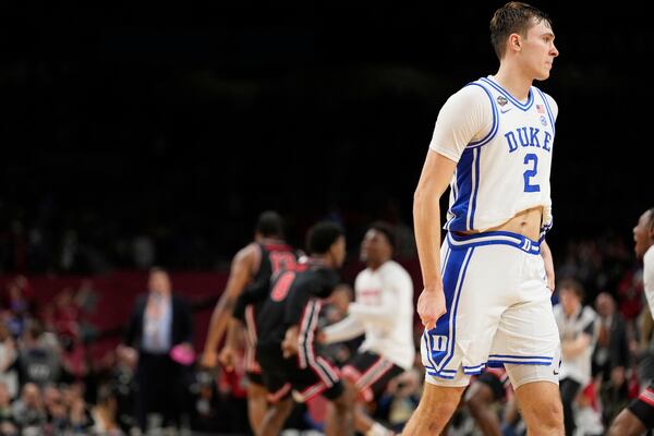 Duke forward Cooper Flagg leaves the court after their loss against the Houston in the national semifinals at the Final Four of the NCAA college basketball tournament, Saturday, April 5, 2025, in San Antonio. (AP Photo/Brynn Anderson)