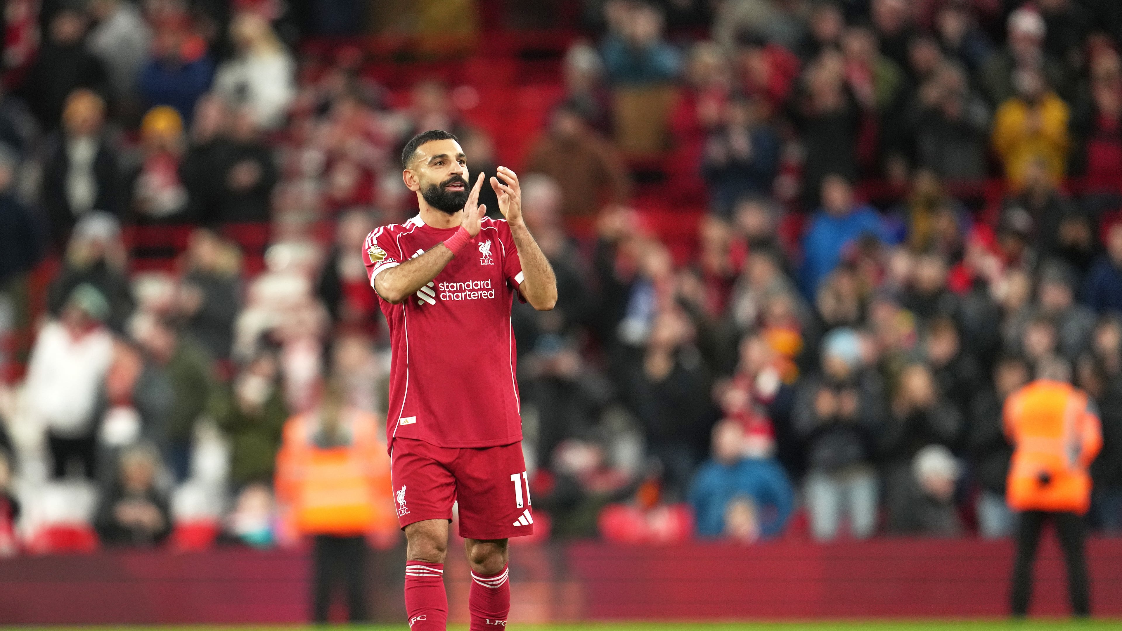 Liverpool's Mohamed Salah applauds supporters after the English Premier League soccer match between Liverpool and Brighton and Hove Albion in Liverpool, England, Saturday, Dec. 13, 2025. (AP Photo/Jon Super)