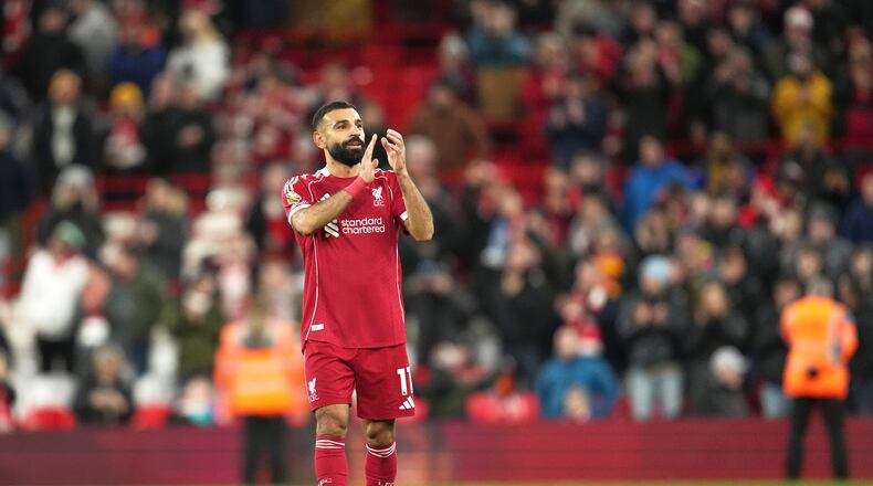 Liverpool's Mohamed Salah applauds supporters after the English Premier League soccer match between Liverpool and Brighton and Hove Albion in Liverpool, England, Saturday, Dec. 13, 2025. (AP Photo/Jon Super)