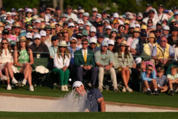 Rory McIlroy, of Northern Ireland, hits from the bunker on the 18th hole during the final round at the Masters golf tournament, Sunday, April 13, 2025, in Augusta, Ga. (AP Photo/Matt Slocum)