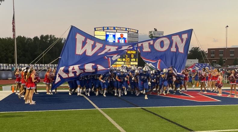 Walton players take the field for their game against North Paulding on Sept. 29, 2023, at Raider Valley in Marietta. Walton won 44-24 to improve to 5-0.