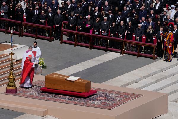 Dean of the College of Cardinals Giovanni Battista Re spreads incense around the coffin of Pope Francis during his funeral in St. Peter's Square at the Vatican, Saturday, April 26, 2025. (AP Photo/Gregorio Borgia)