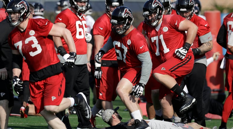 Falcons tackle Ryan Schraeder (73), guard Andy Levitre (67) and guard Wes Schweitzer (71) run through drills with teammates during a practice for the Super Bowl on Thursday, Feb. 2, 2017, in Houston. (AP Photo/Eric Gay)