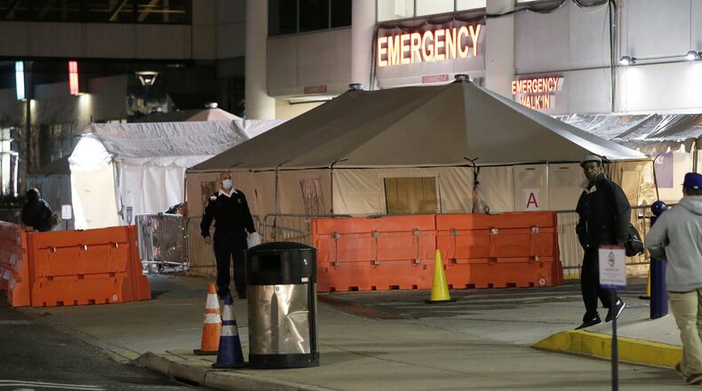 Portable medical tents are set up outside a Philiadelphia hospital. Pregnancy and deliveries are creating care challenges during the pandemic, and African American women are said to be especially at risk. (Elizabeth Robertson/The Philadelphia Inquirer/TNS)