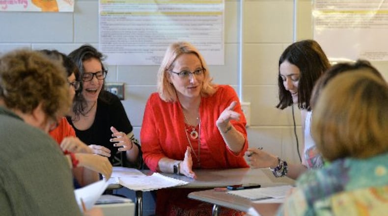 Natalie Williams talks to her creative writing students at Dunwoody High School. (AJC FILE PHOTO)
