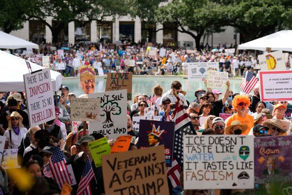 People gather at the "No Kings" nationwide demonstration on Saturday, June 14, 2025 in Houston. (Raquel Natalicchio/Houston Chronicle via AP)